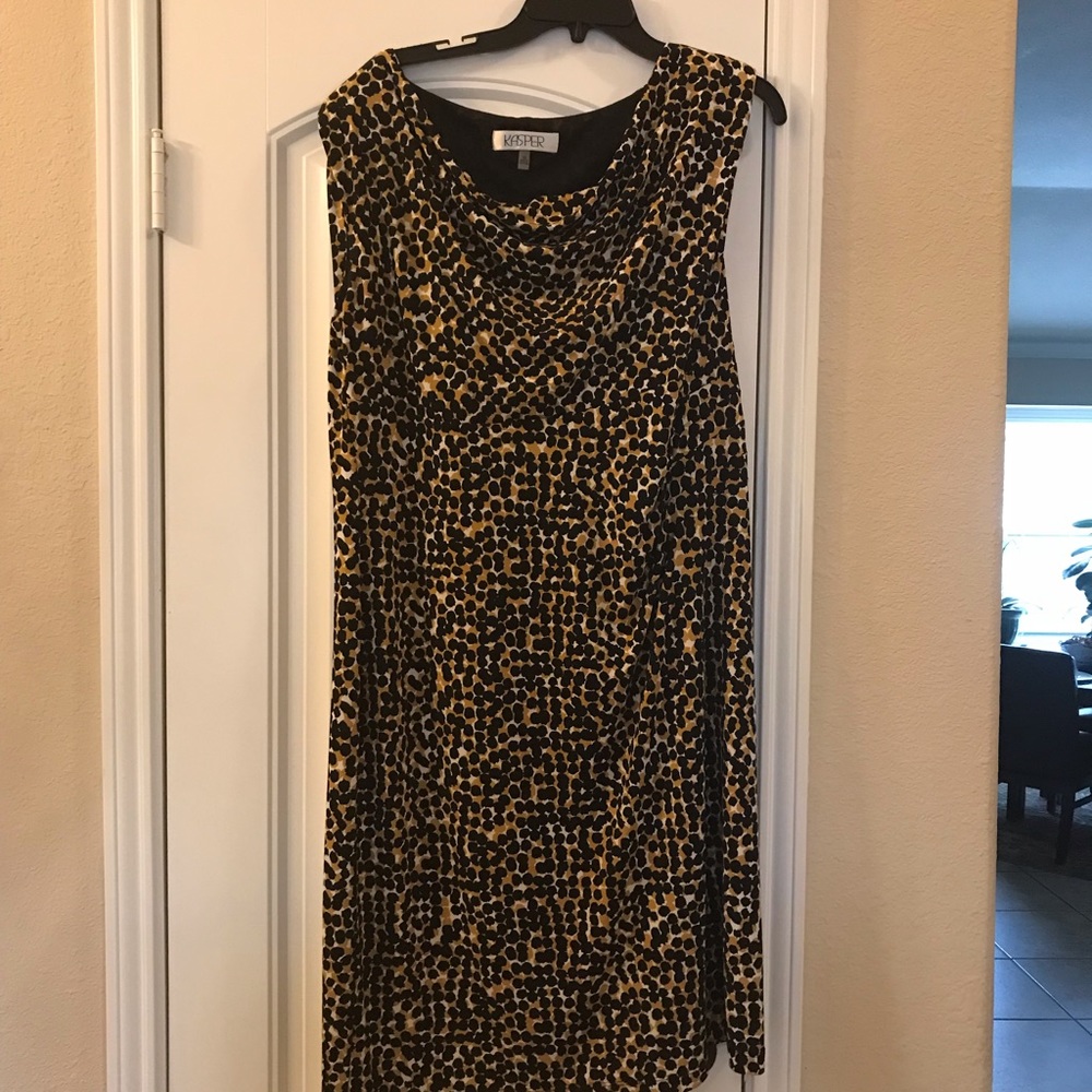 Sleeveless draped front “feel-good” classy dress.